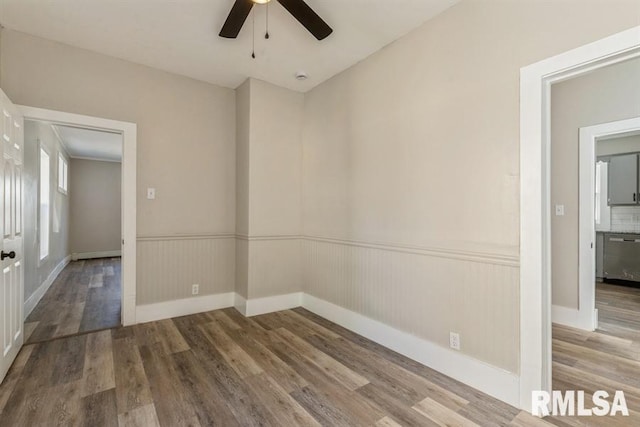 unfurnished room with wood-type flooring and ceiling fan