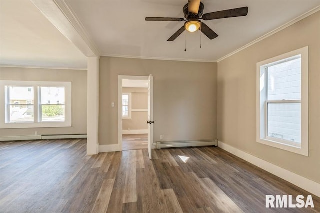 unfurnished room with crown molding, hardwood / wood-style floors, ceiling fan, and a baseboard radiator