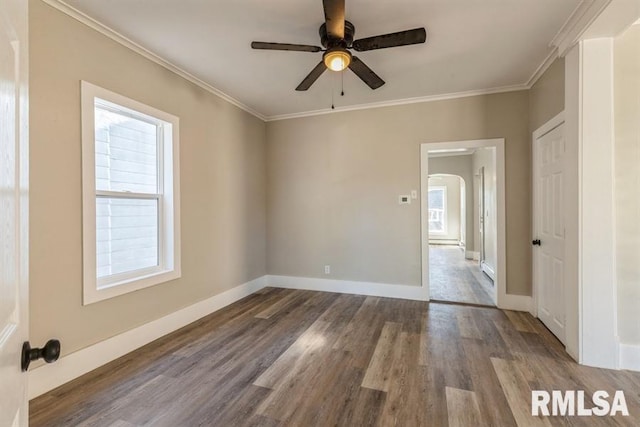 unfurnished room with ceiling fan, hardwood / wood-style flooring, and crown molding