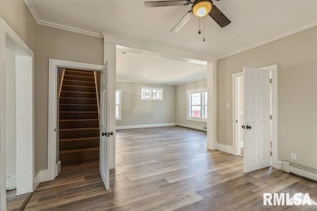 unfurnished room with a baseboard radiator, ceiling fan, hardwood / wood-style flooring, and crown molding