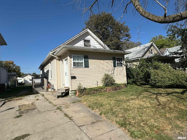 view of home's exterior with a lawn