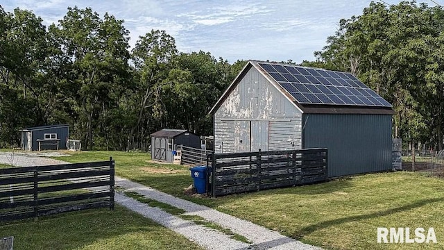 view of outbuilding featuring a yard