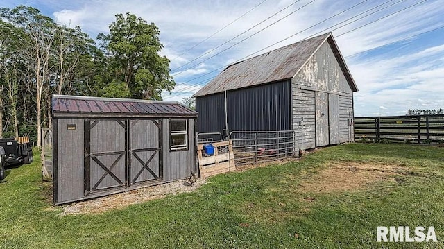 view of outbuilding with a yard