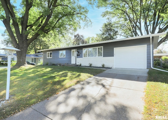 ranch-style house with a front yard and a garage