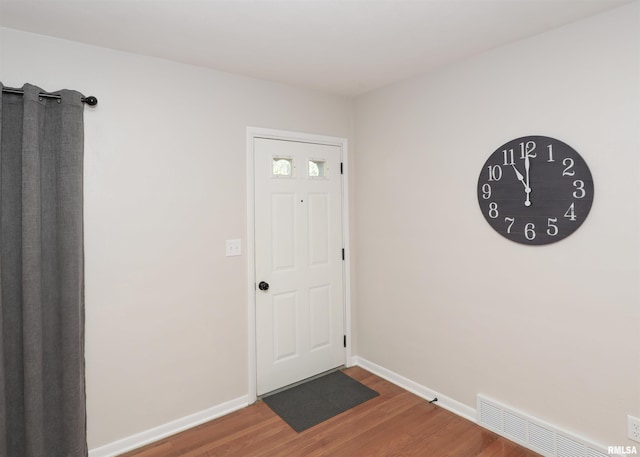 entrance foyer featuring wood-type flooring