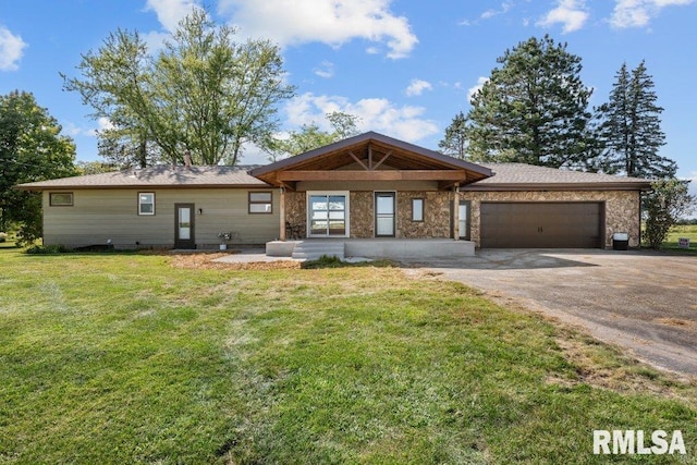 view of front of house featuring a garage and a front lawn