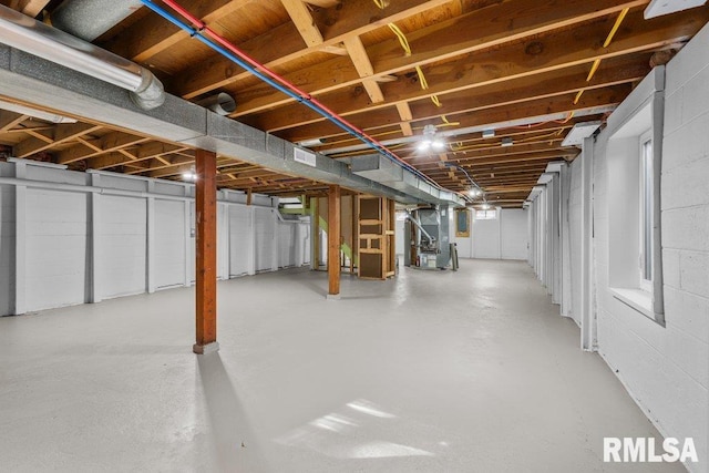 basement featuring heating unit