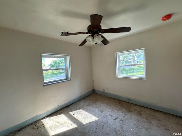 unfurnished room with ceiling fan