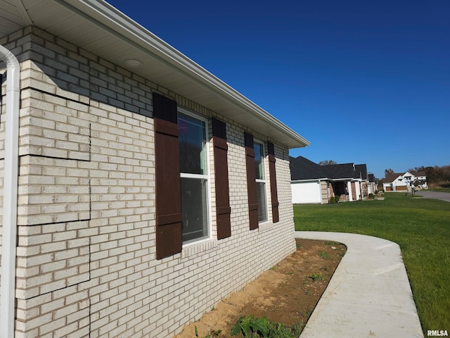 view of home's exterior with a yard