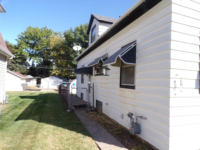 view of property exterior with a yard