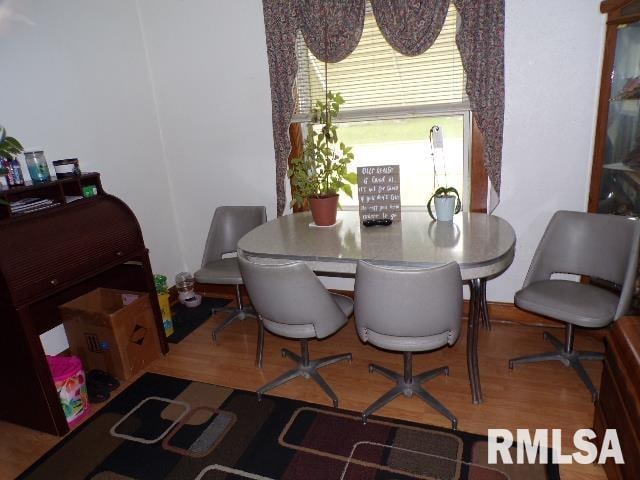 dining space featuring hardwood / wood-style flooring