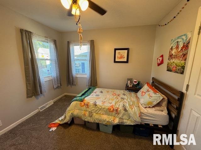 carpeted bedroom featuring ceiling fan