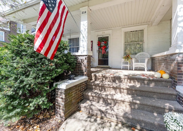 entrance to property featuring a porch