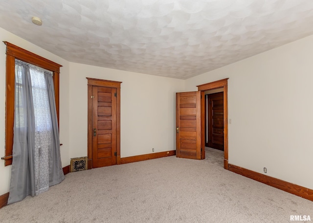 unfurnished bedroom with light carpet