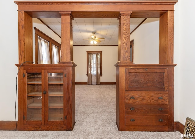 interior space featuring carpet and ceiling fan