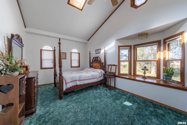 carpeted bedroom with ceiling fan and lofted ceiling with skylight