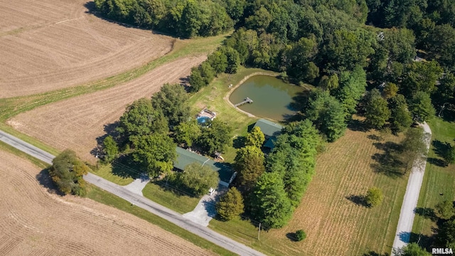 birds eye view of property with a water view and a rural view