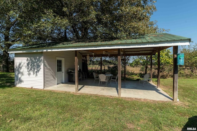 exterior space with a lawn, a gazebo, and a patio