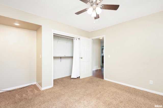 unfurnished bedroom with ceiling fan, a closet, and carpet