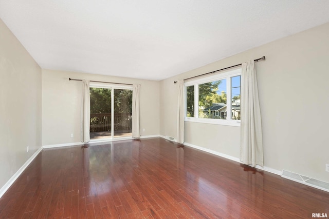 unfurnished room with wood-type flooring