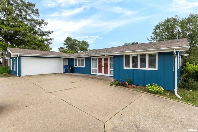 single story home featuring a garage