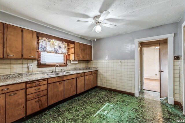 interior space with ceiling fan, dark wood-type flooring, and a wealth of natural light