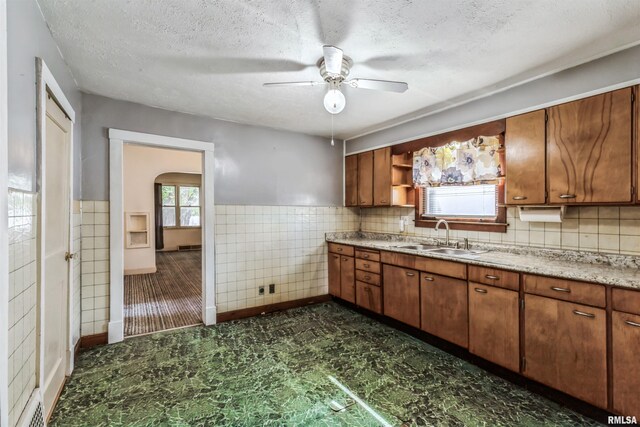 empty room featuring hardwood / wood-style flooring and ceiling fan