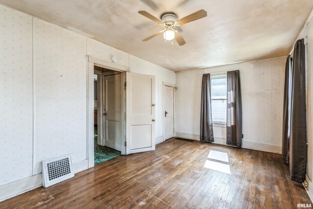 basement with plenty of natural light, heating unit, and sink