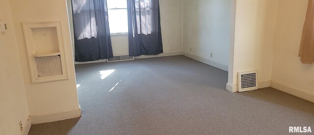 carpeted empty room with plenty of natural light