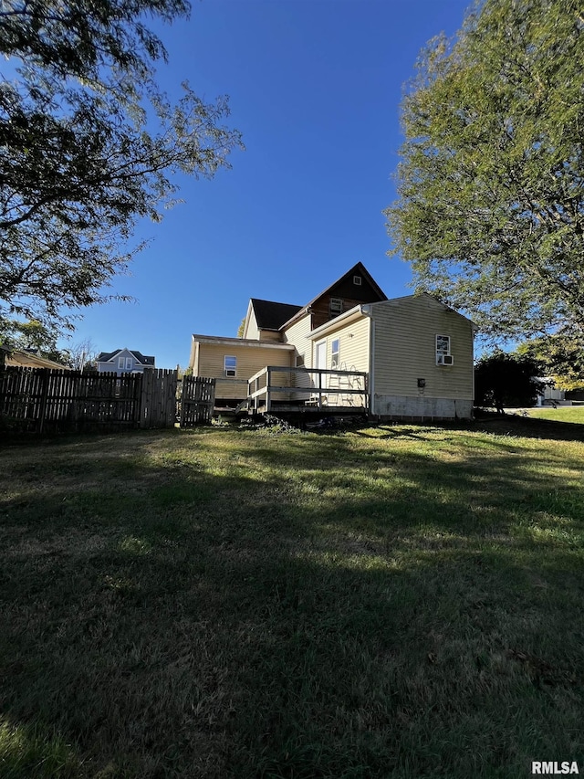 view of yard with fence and a wooden deck