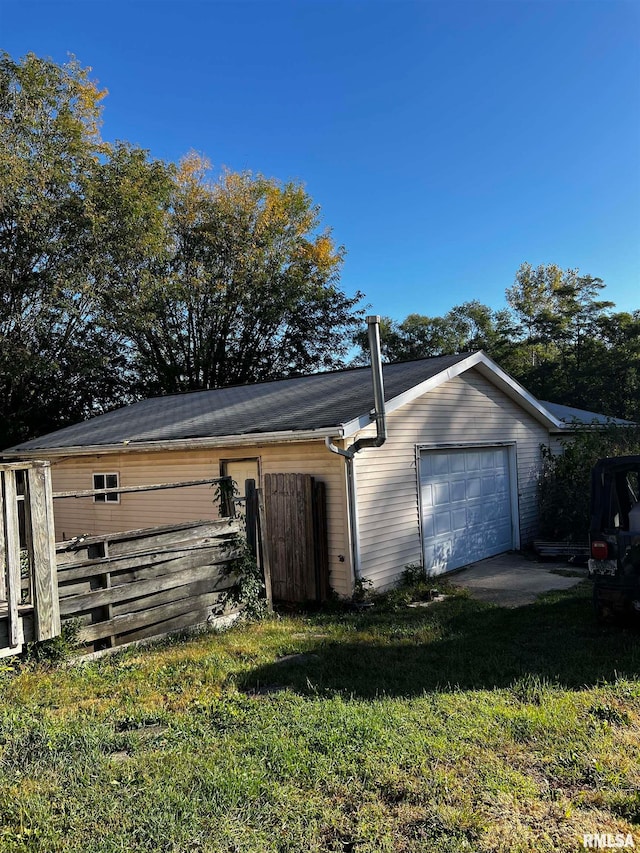 view of outbuilding featuring a lawn