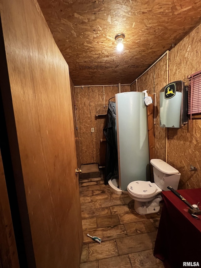 full bathroom with toilet and a shower stall