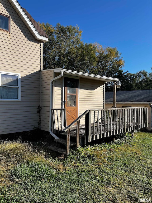 exterior space with a lawn and a deck