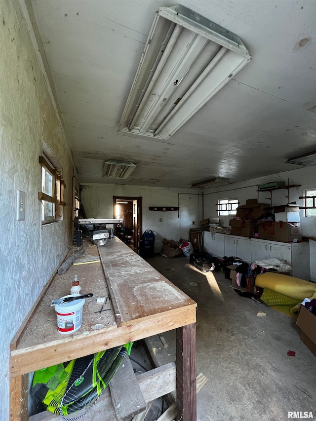 misc room featuring a healthy amount of sunlight and concrete floors