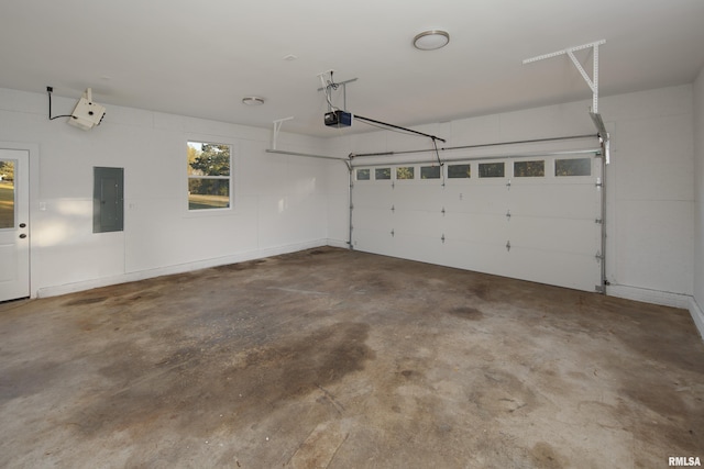 garage featuring a garage door opener and electric panel