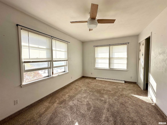 unfurnished room with carpet floors, ceiling fan, and a baseboard radiator