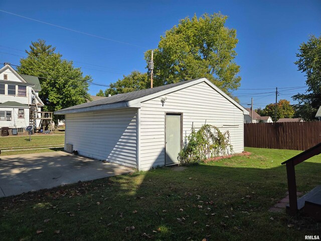 garage with a lawn