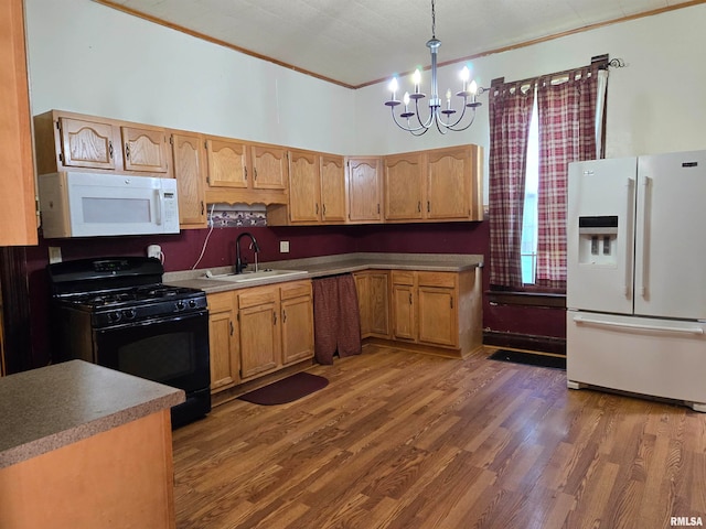 kitchen with ornamental molding, sink, white appliances, decorative light fixtures, and dark wood-type flooring