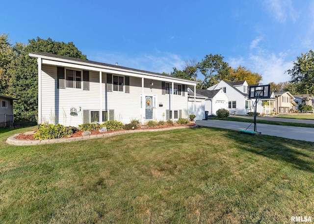 bi-level home with a front lawn