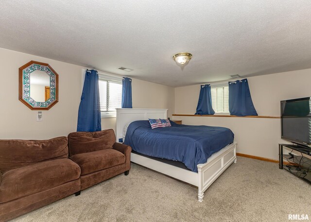 carpeted bedroom with a textured ceiling