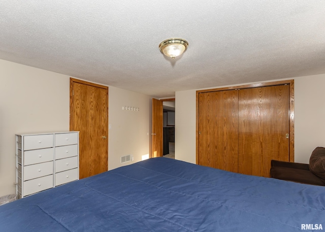 unfurnished bedroom with a closet and a textured ceiling