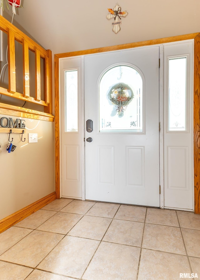 foyer entrance featuring light tile patterned floors