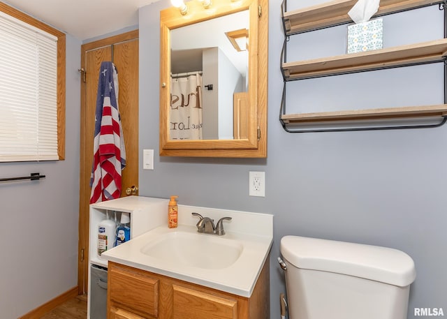 bathroom with vanity and toilet