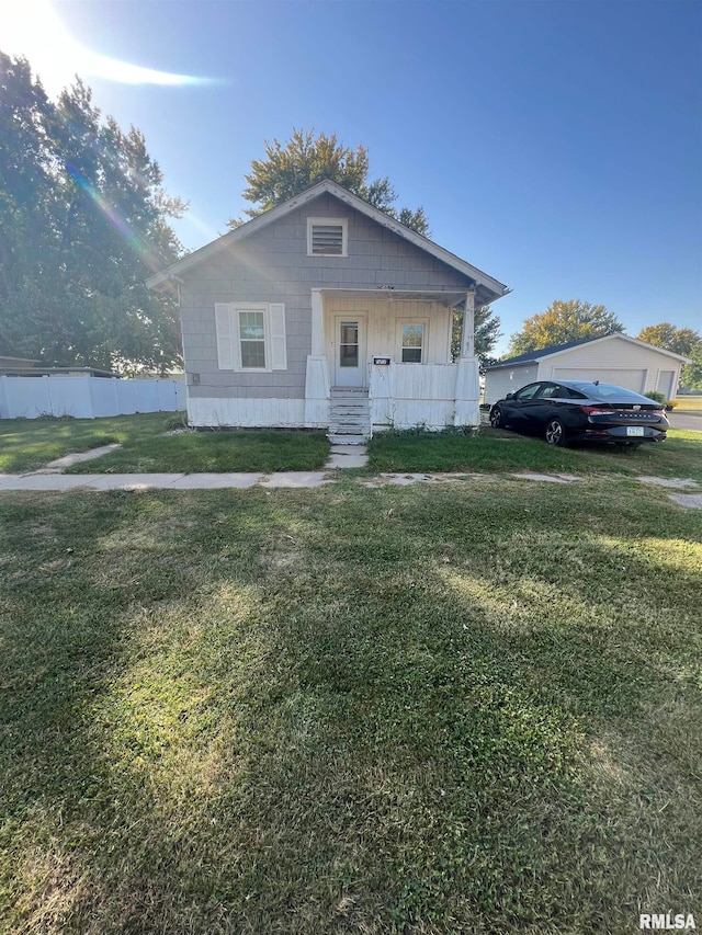 bungalow-style house featuring a front yard