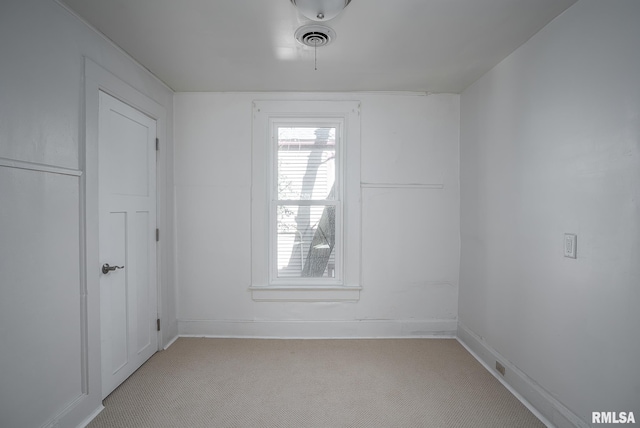 718 17th St, Rock Island, IL 61201 - spare room with light carpet, visible vents, and baseboards