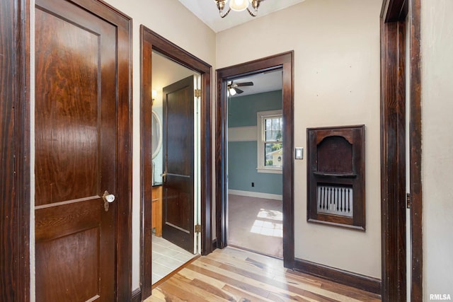 hall with light hardwood / wood-style flooring