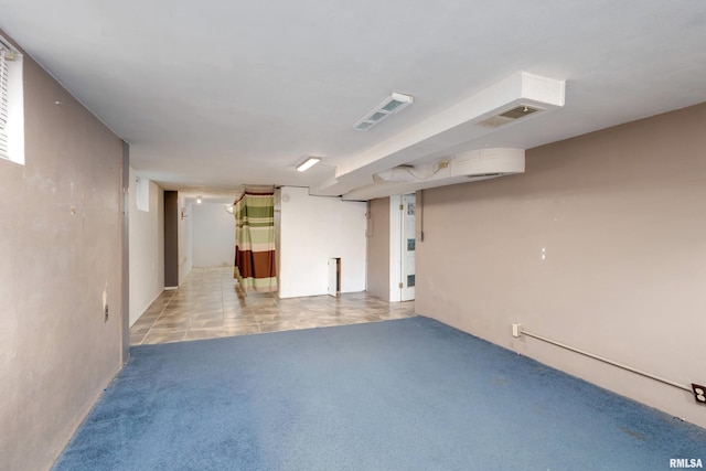 unfurnished room featuring light tile patterned floors