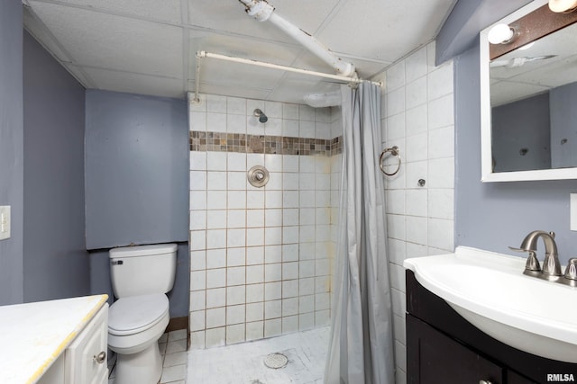 bathroom featuring curtained shower, vanity, and toilet