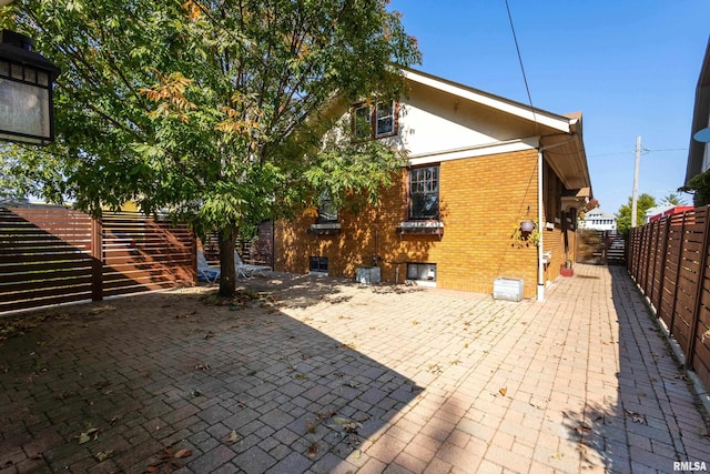 back of property with a patio