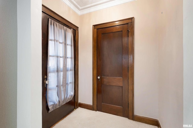 entryway with light colored carpet and ornamental molding